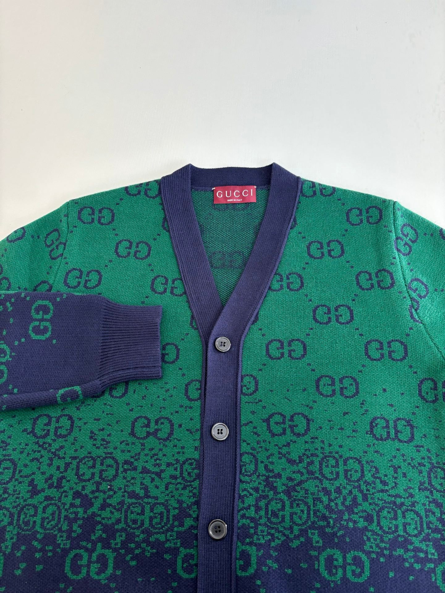 Gucci long cardigan detail: purple placket, green GG jacquard knit, button front