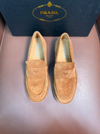 Prada unisex tan suede loafers, slip-on design with triangular logo on vamp.
