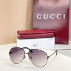 Dark metal round sunglasses with tinted purple lenses and slim straight arms
