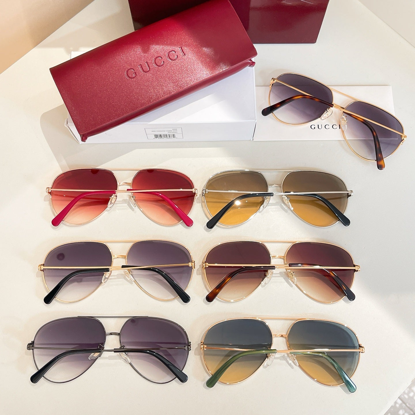 Assorted sunglasses with round lenses in multiple frames, including gold and dark styles