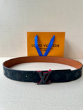 Louis Vuitton belt with dark monogram strap and red-accent LV buckle