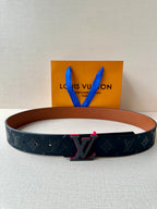 Louis Vuitton belt with dark monogram strap and red-accent LV buckle