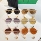 Bottega Veneta glasses assortment with tinted lenses in purple, amber, and orange tones