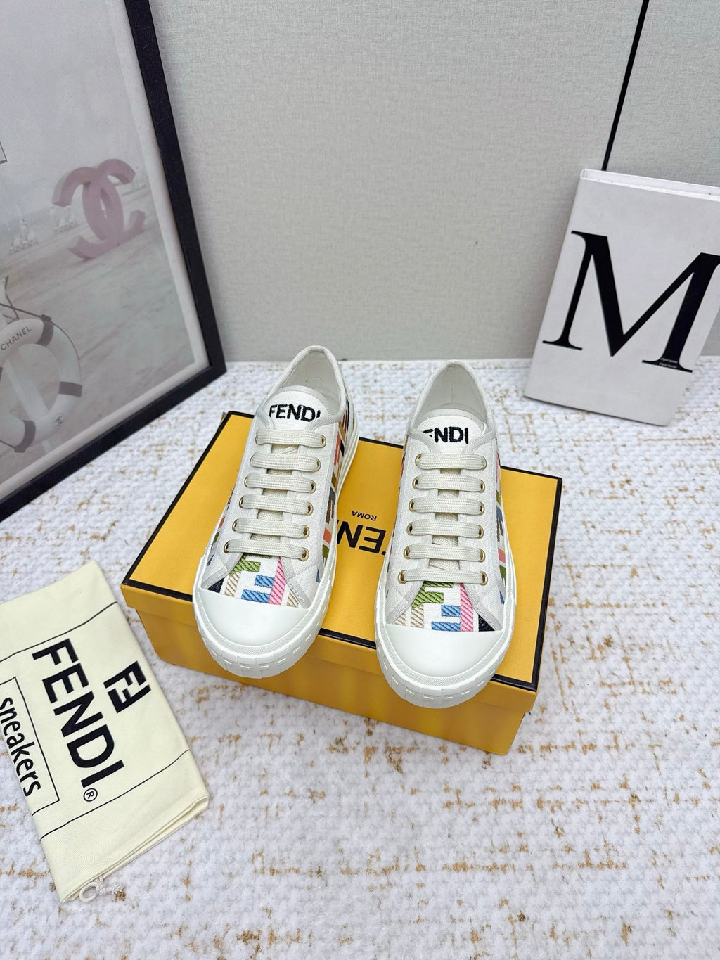 Fendi low-top sneakers, white canvas with colorful graphic accents, paired on box