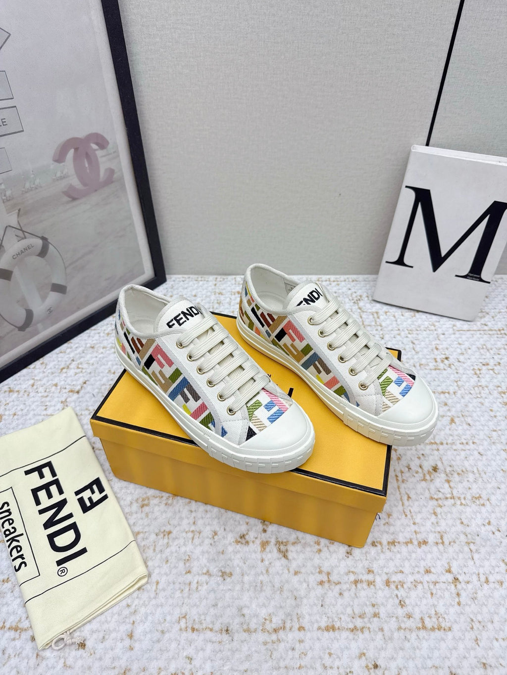 Fendi low-top sneakers with white canvas uppers and multicolor logo print
