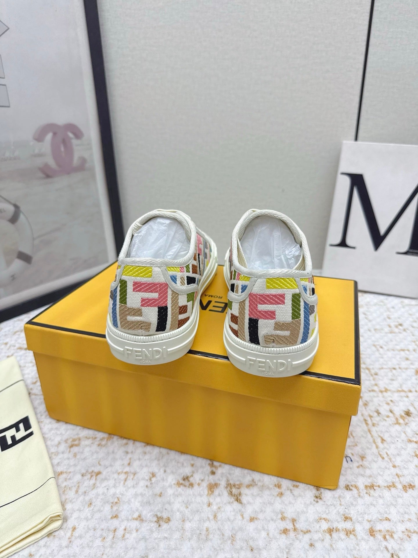 Fendi low-top sneakers rear view with logo print on white canvas heels