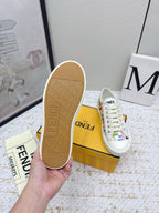 Fendi sneaker outsole, tan rubber tread on bottom of white low-top shoe