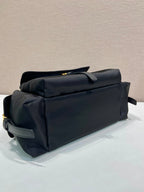 Prada black tote bag side view with handle and compact structured shape