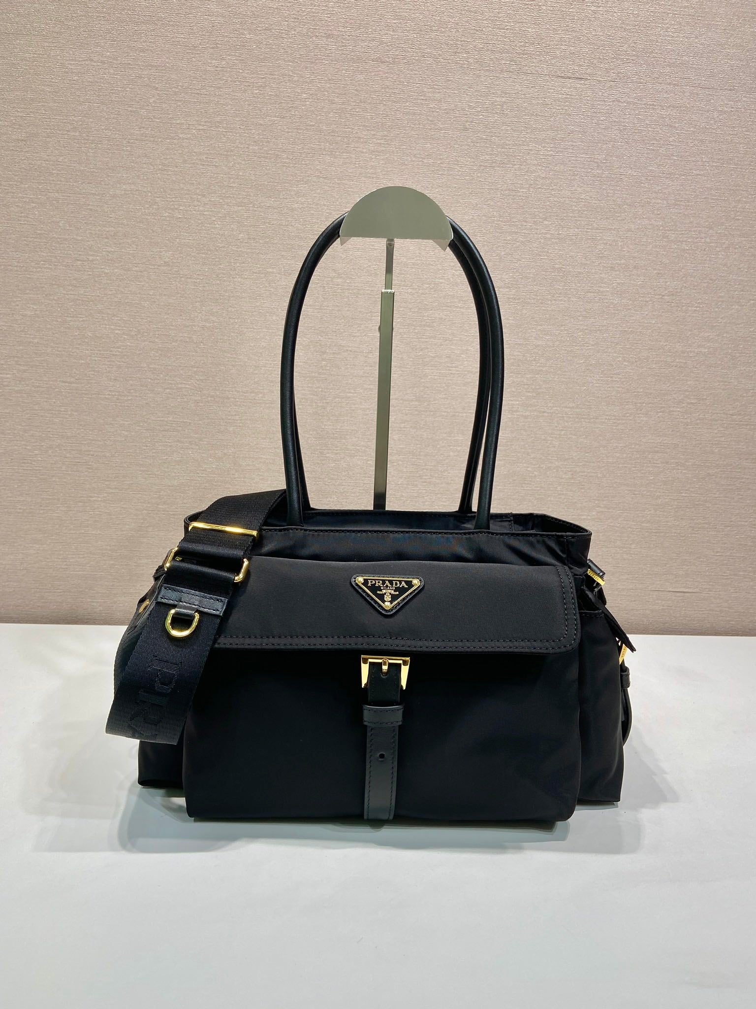 Prada black tote bag with top handles and front logo plaque