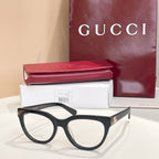 Black eyeglasses with clear lenses and slim side arms, Gucci hardware