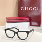 Black eyeglasses with clear lenses and slim side arms, Gucci hardware