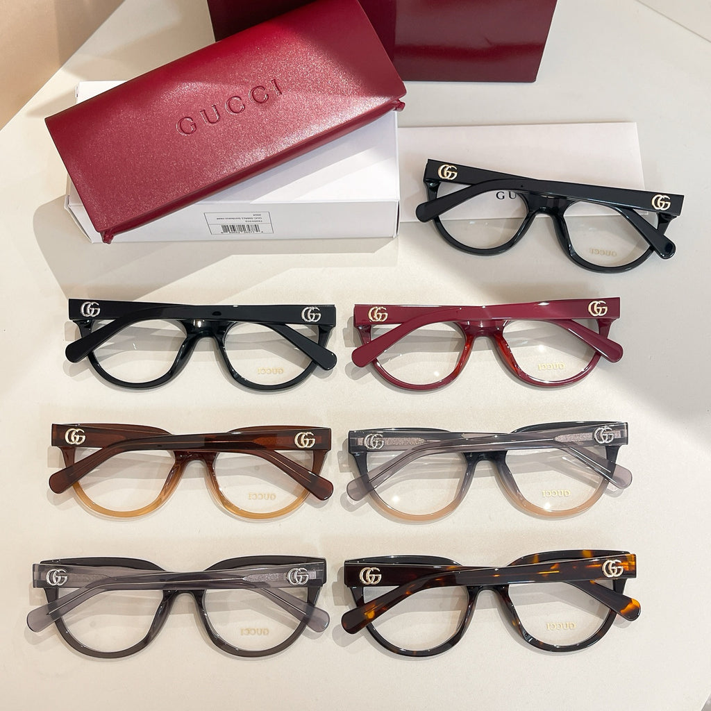 Set of five Gucci eyeglasses with clear lenses in black, red, brown, and gray tones