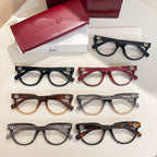 Set of five Gucci eyeglasses with clear lenses in black, red, brown, and gray tones