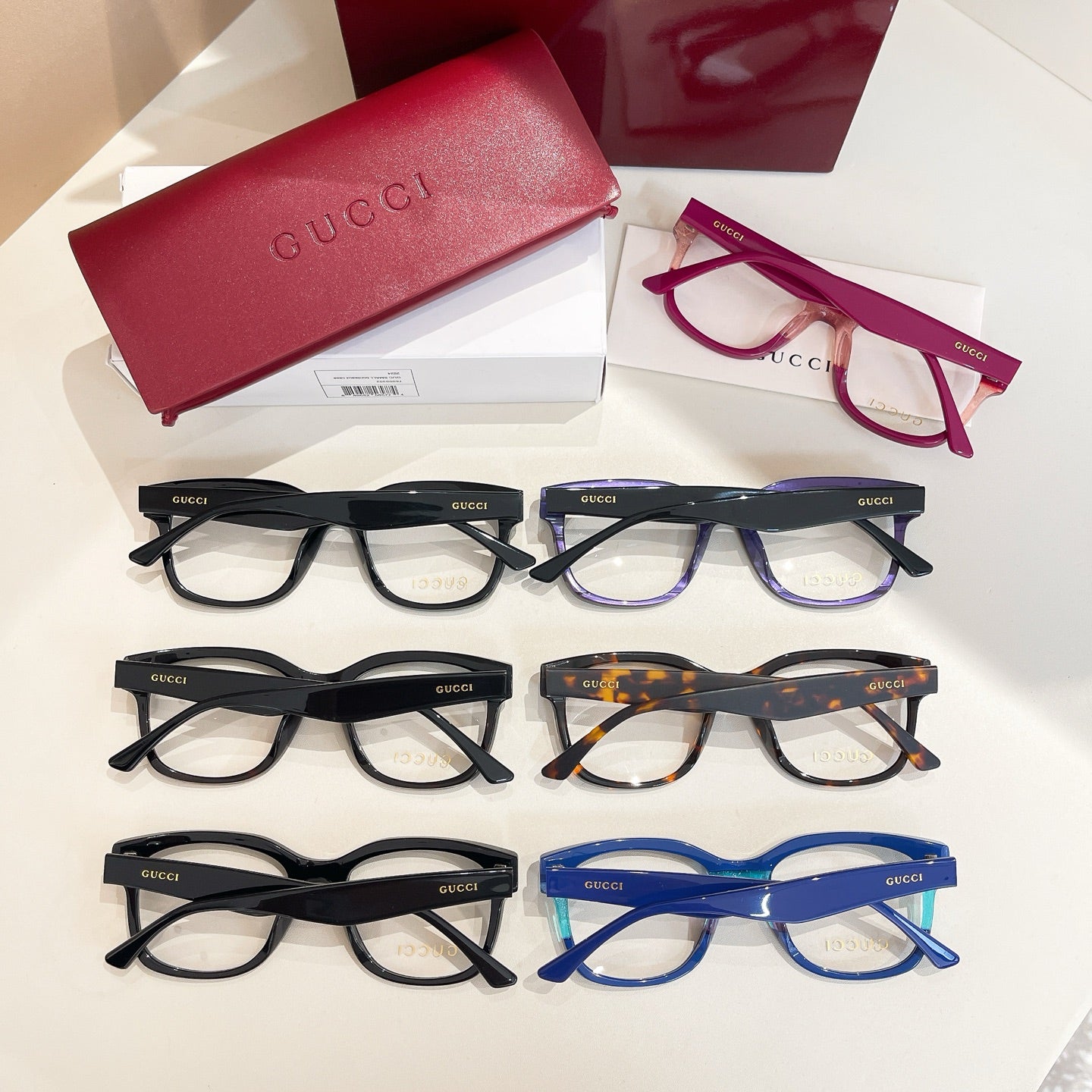 Gucci glasses set with mixed black, burgundy, tortoiseshell, and blue frames