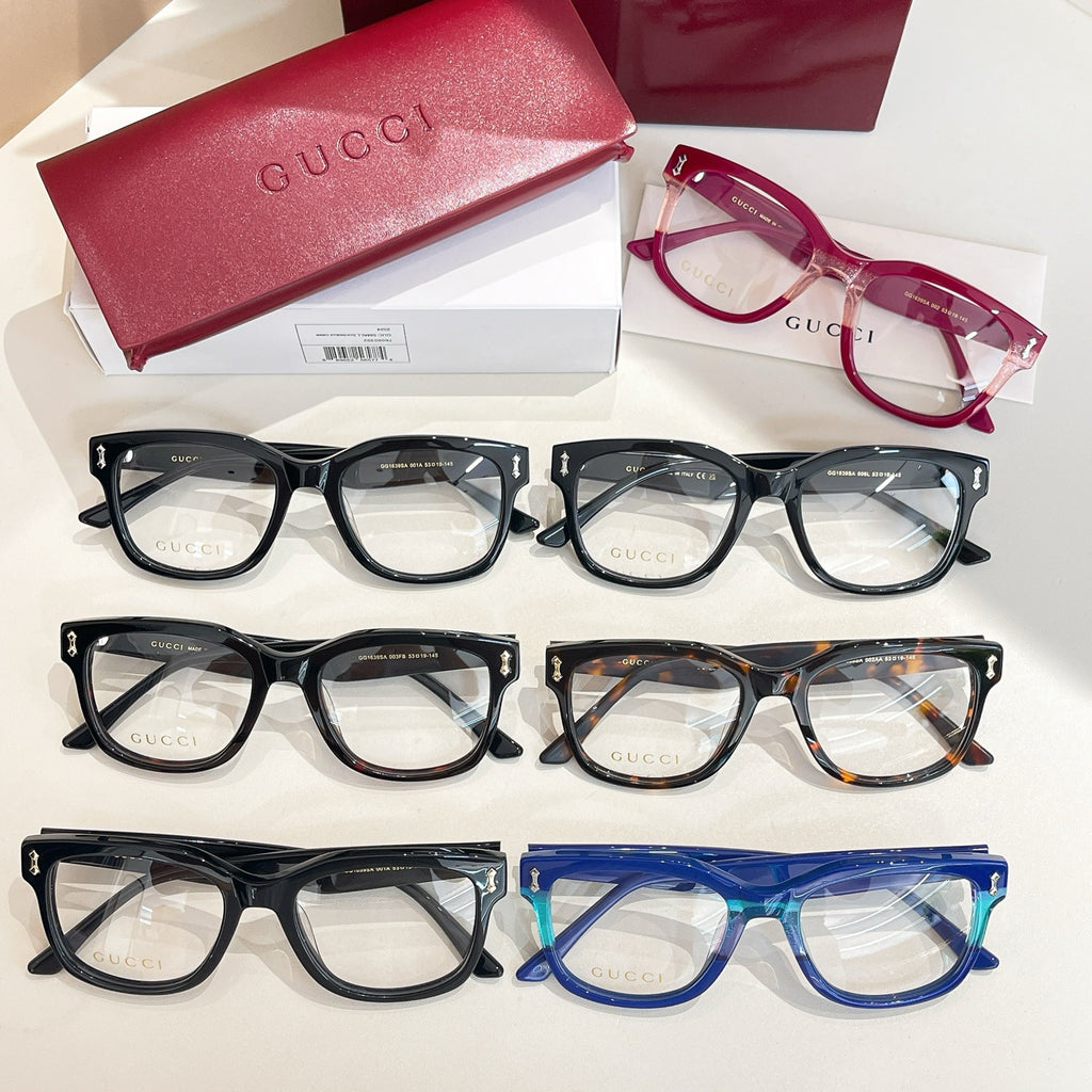Gucci glasses set with mixed black, burgundy, tortoiseshell, and blue frames