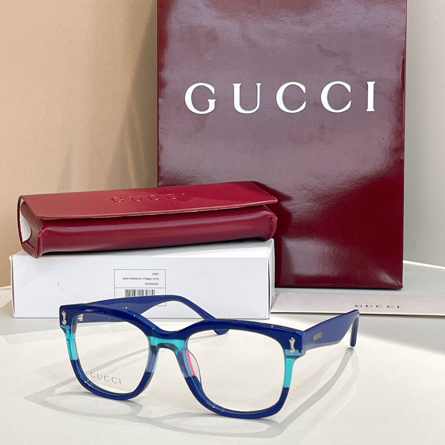 Gucci glasses with blue rectangular frames and clear lenses