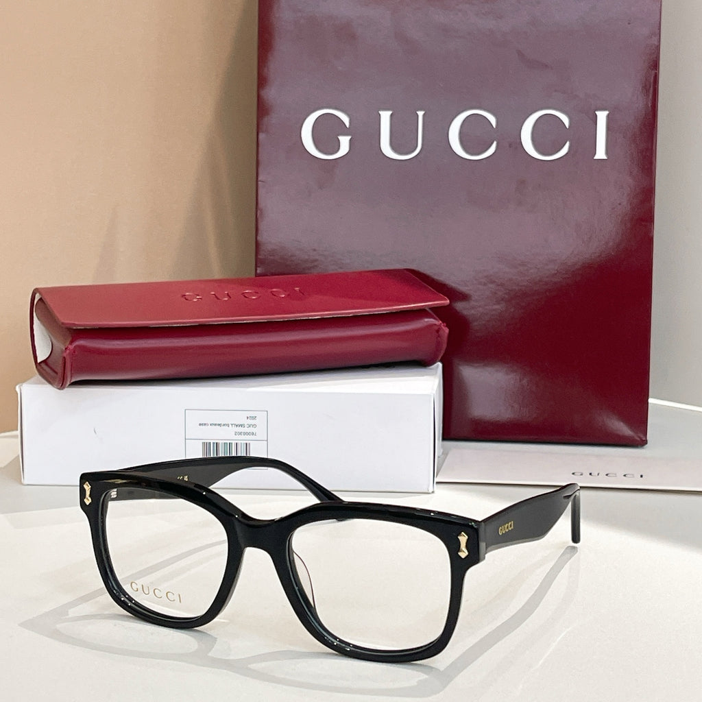 Gucci glasses with black rectangular frames and clear lenses