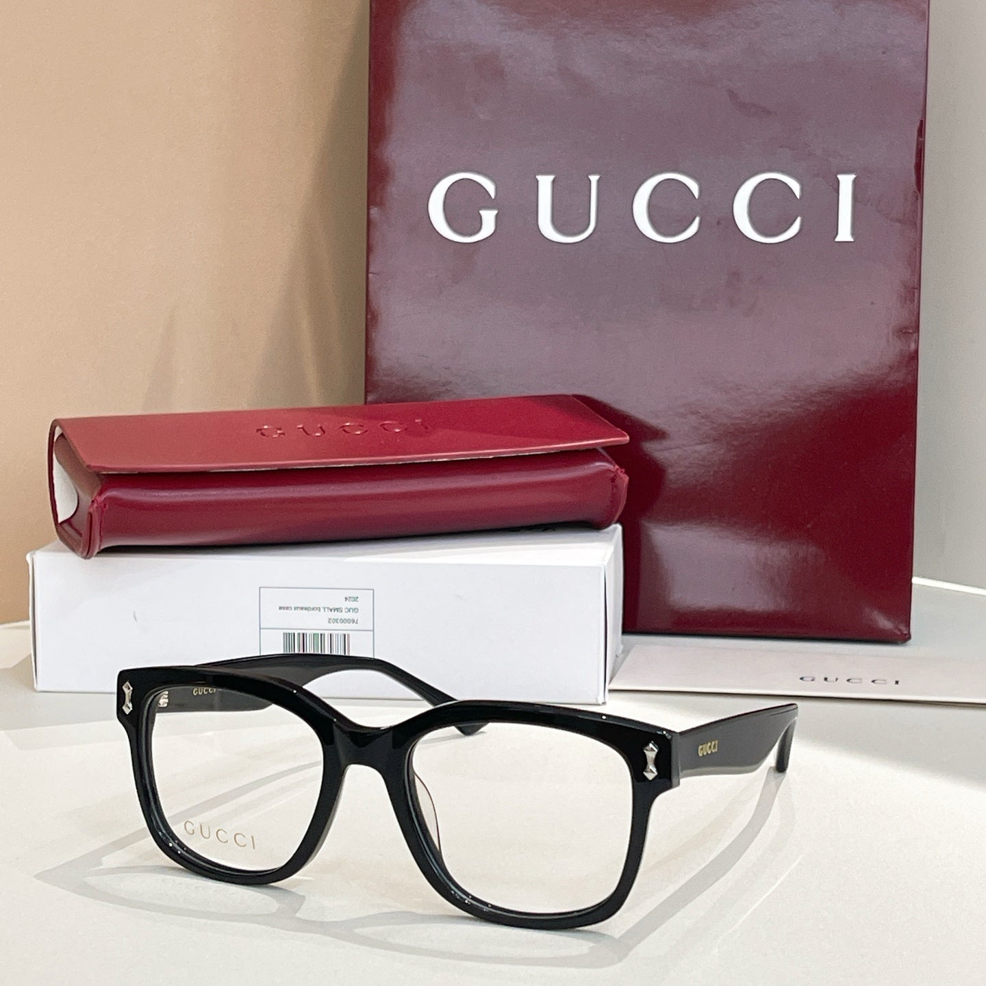 Gucci glasses with black rectangular frames and clear lenses