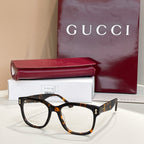 Gucci glasses with tortoiseshell rectangular frames and clear lenses