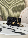 Quilted Chanel shoulder bag in black with gold-tone CC clasp and chain strap