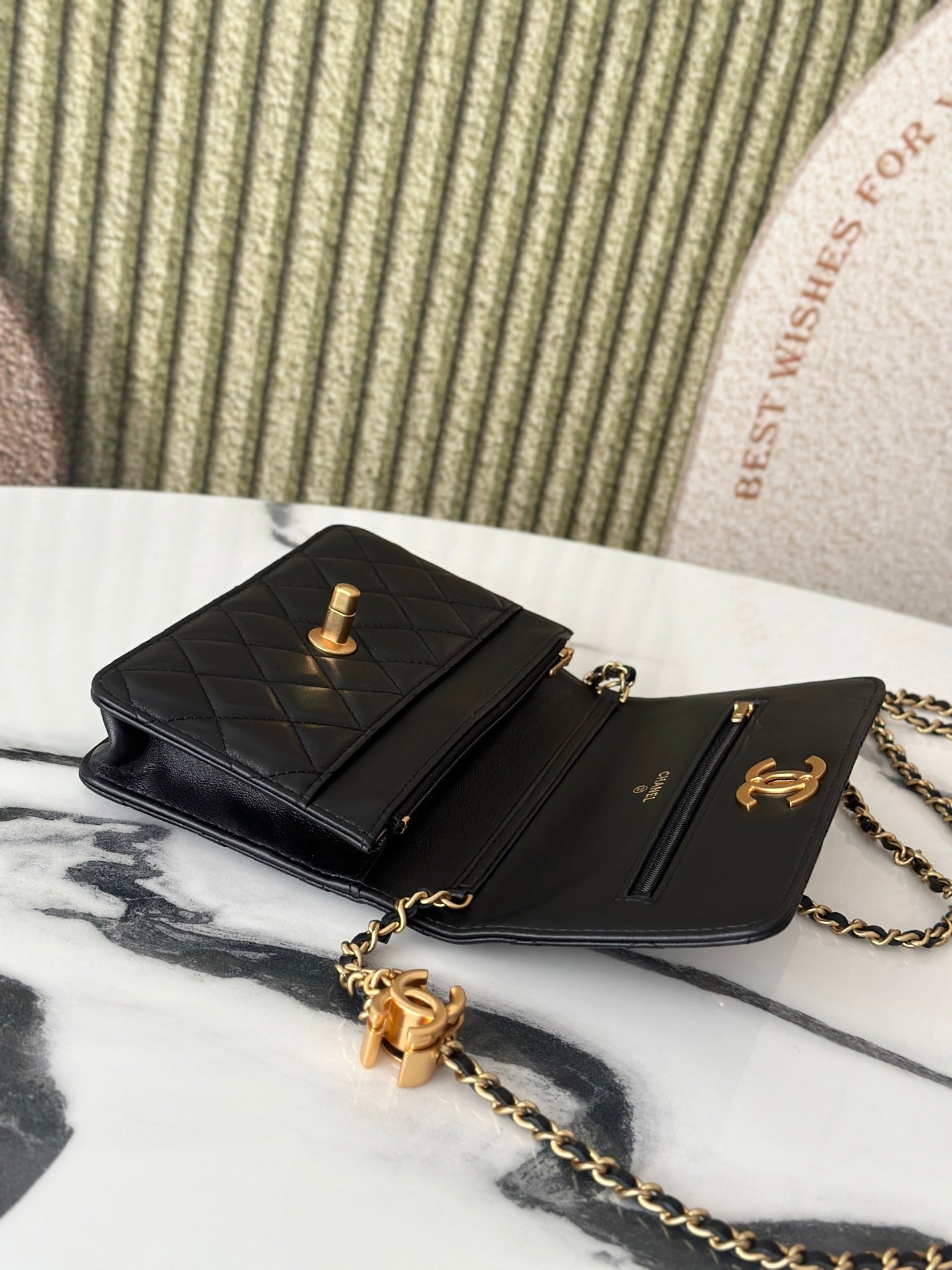 Two-panel Chanel black bag with quilted flap, gold-tone CC hardware and chain