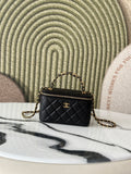 Chanel quilted mini bag with top handle and gold chain strap, black exterior