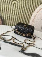 Chanel quilted mini bag with gold chain strap and small zipper, black