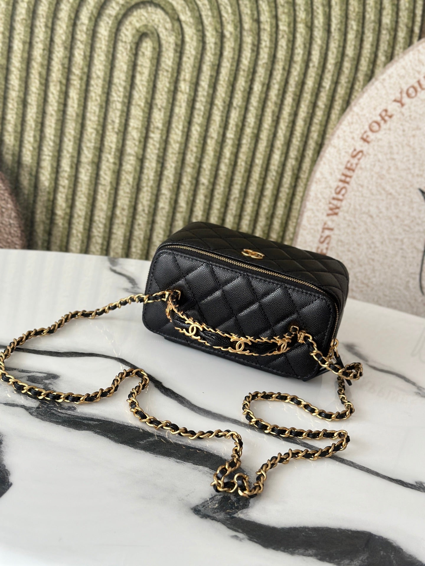 Chanel quilted mini bag with gold chain strap and small zipper, black
