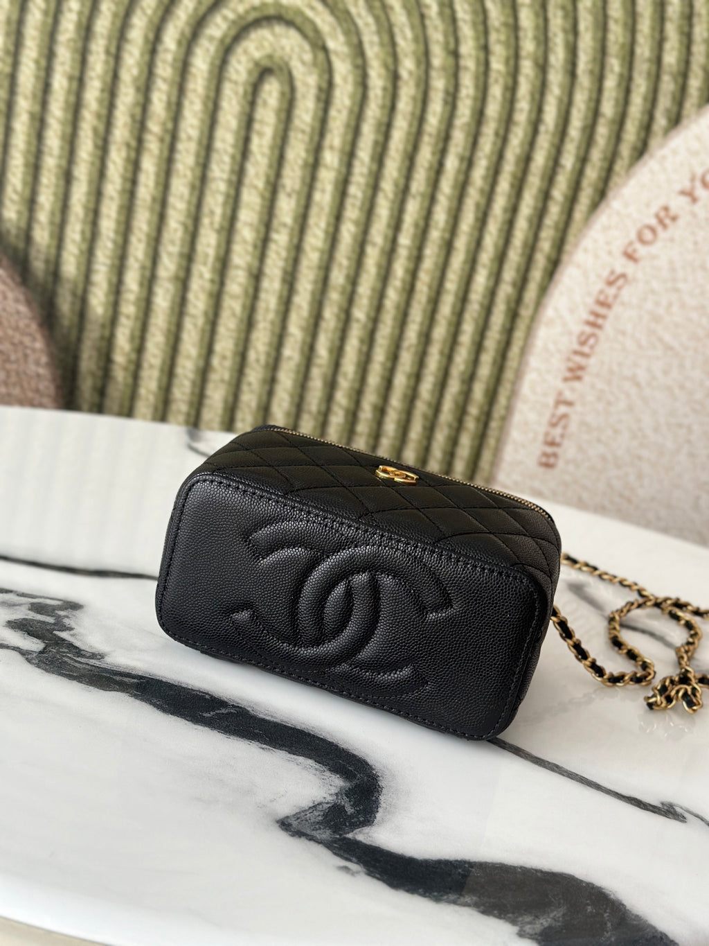 Chanel quilted mini bag with embossed CC logo and chain strap, black