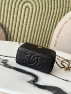 Chanel quilted mini bag with embossed CC logo and chain strap, black