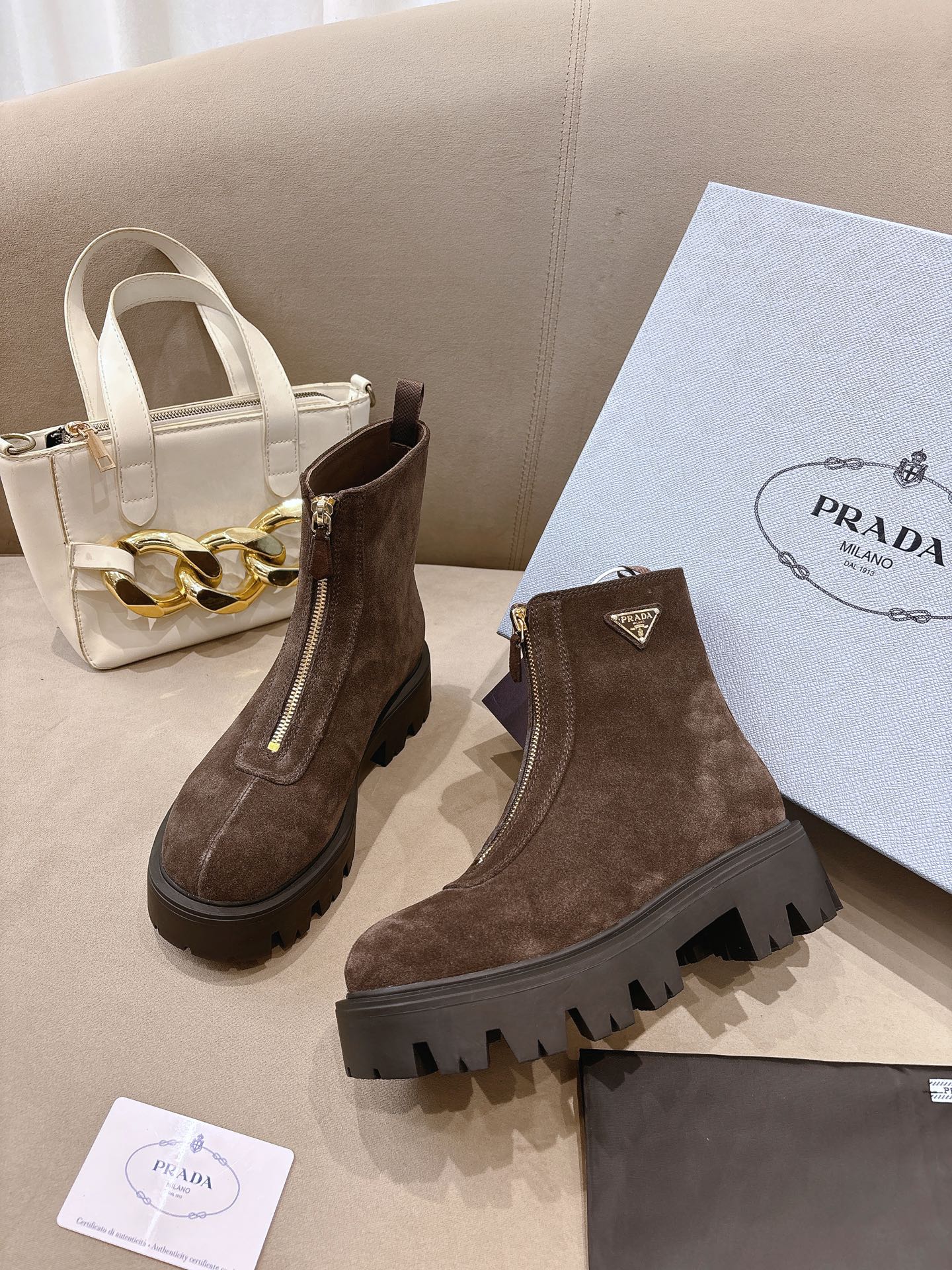 Prada ladies ankle boots, dark brown suede Chelsea style, side zip and lug sole.