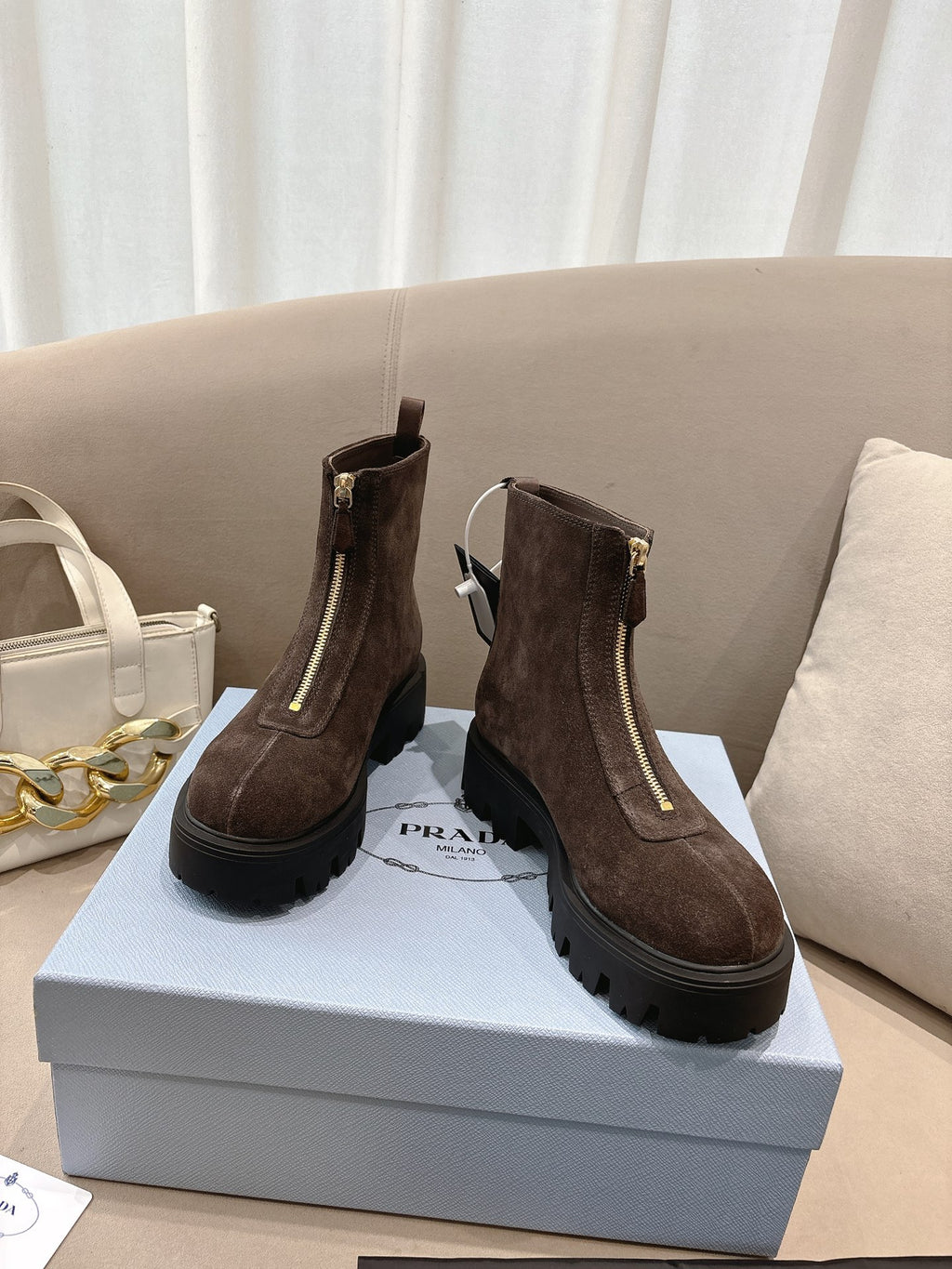 Prada ladies ankle boots, dark brown suede, side zipper and rubber lug sole.