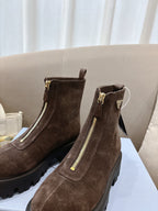 Prada ladies ankle boots, dark brown suede with gold-tone side zippers and lug soles.