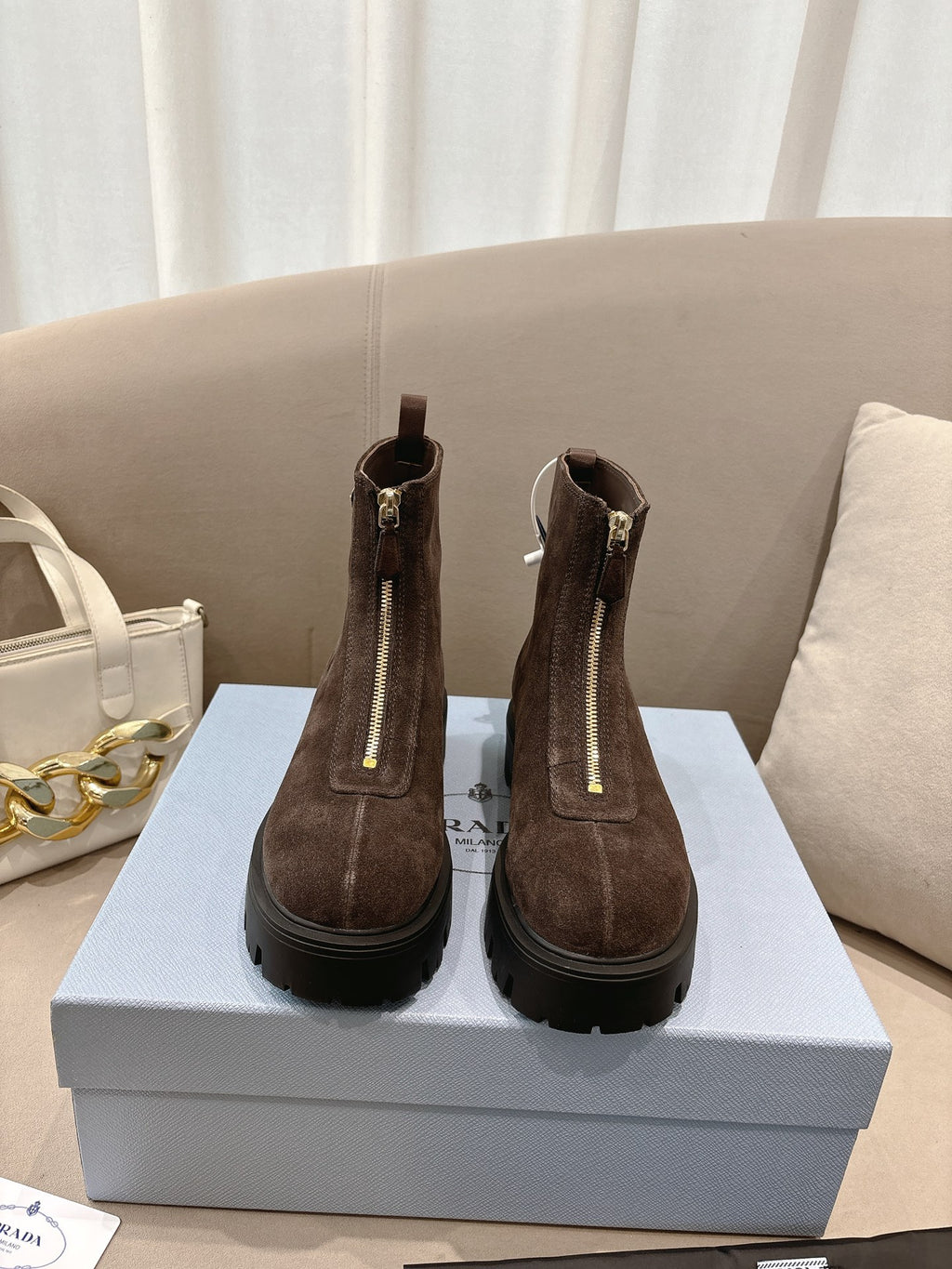 Prada ladies ankle boots, dark brown suede with side zipper and lug sole.