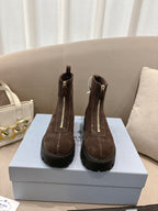 Prada ladies ankle boots, dark brown suede with side zipper and lug sole.