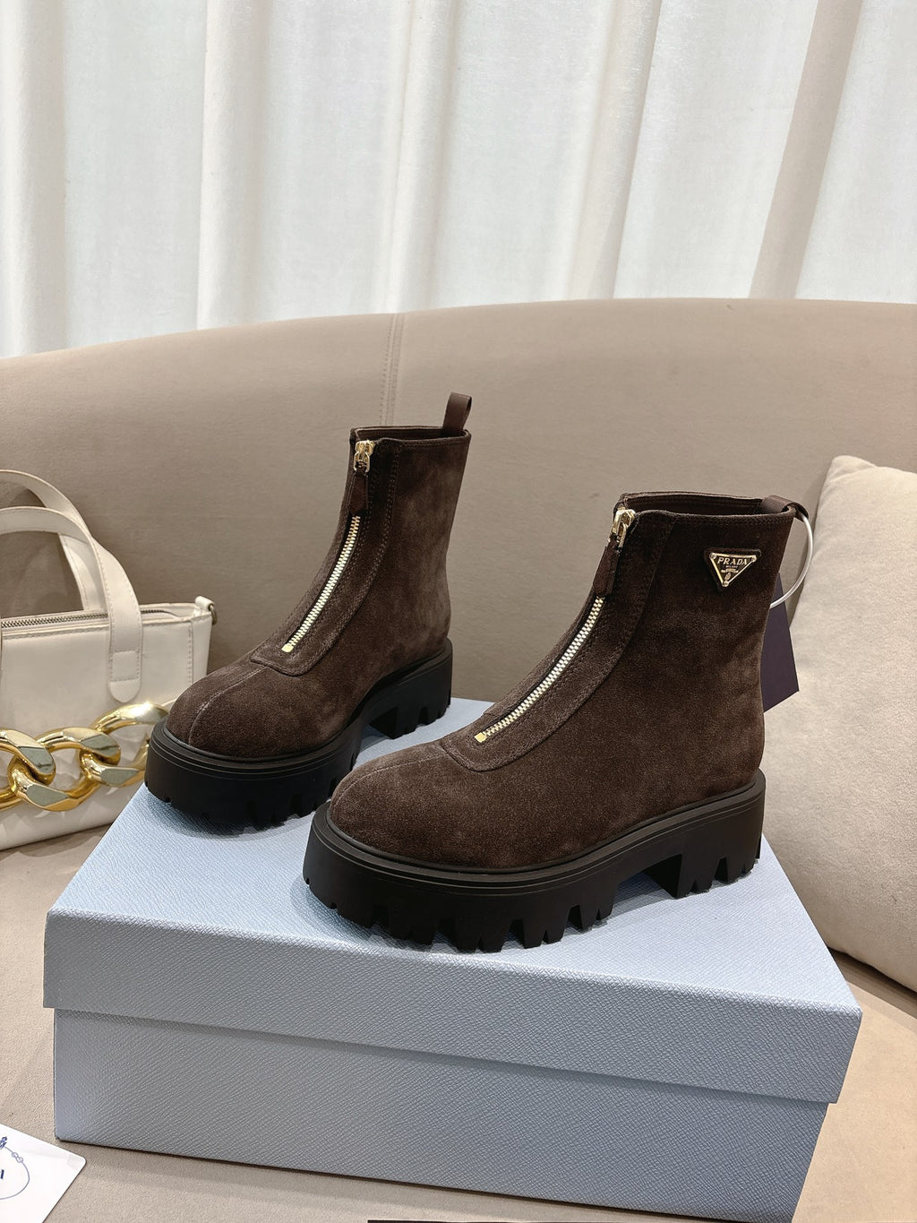 Prada ladies ankle boots, dark brown suede with pull tab, side zip, chunky sole.