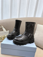 Prada ladies black leather ankle boots with side buckle and chunky lug sole