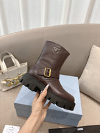 Prada ladies ankle boots with dark brown leather upper, gold buckle, rugged lug sole