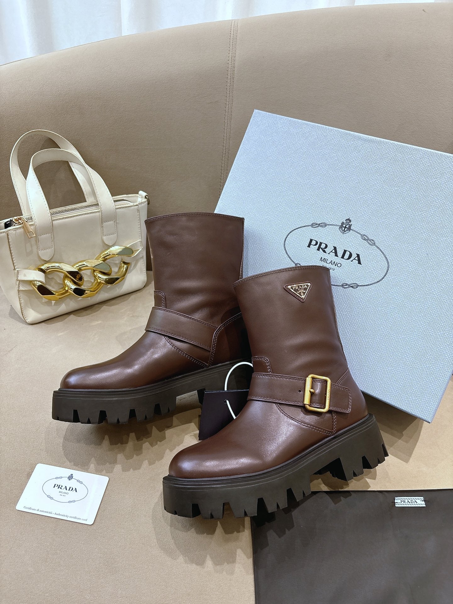 Prada ladies ankle boots, dark brown leather, gold buckle, PRADA logo patch