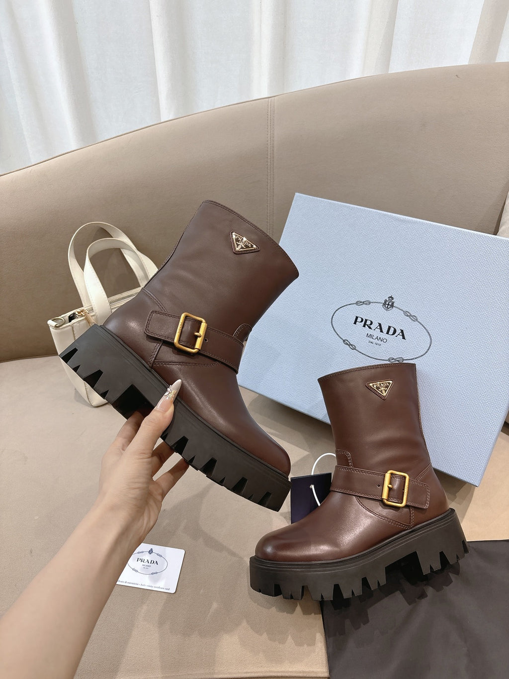 Prada ladies ankle boots, dark brown leather, gold buckle, rugged rubber lug sole