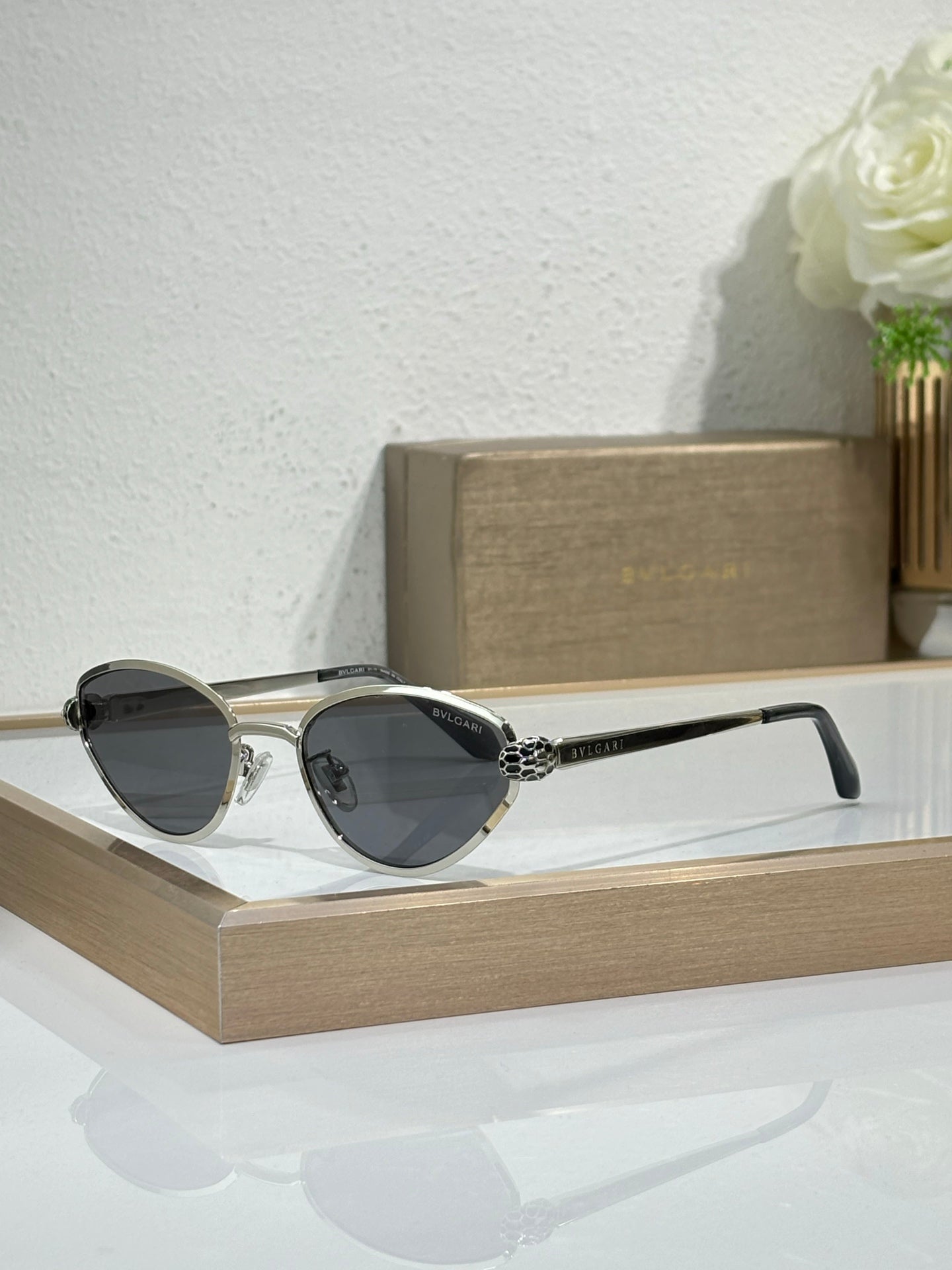 Bvlgari glasses with silver-tone metal frame and dark cat-eye lenses