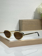 Bvlgari glasses with gold-tone metal frame and brown-tinted cat-eye lenses