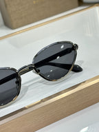 Bvlgari glasses with dark cat-eye lenses and black outer frame on display
