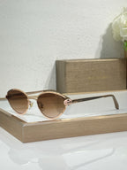 Bvlgari glasses with rose gold-tone metal frame and brown-tinted round lenses