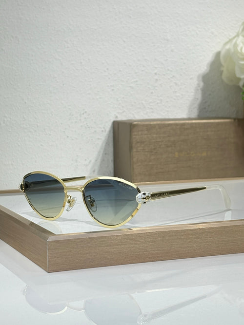 Bvlgari glasses with gold-tone metal frame and blue-tinted round lenses
