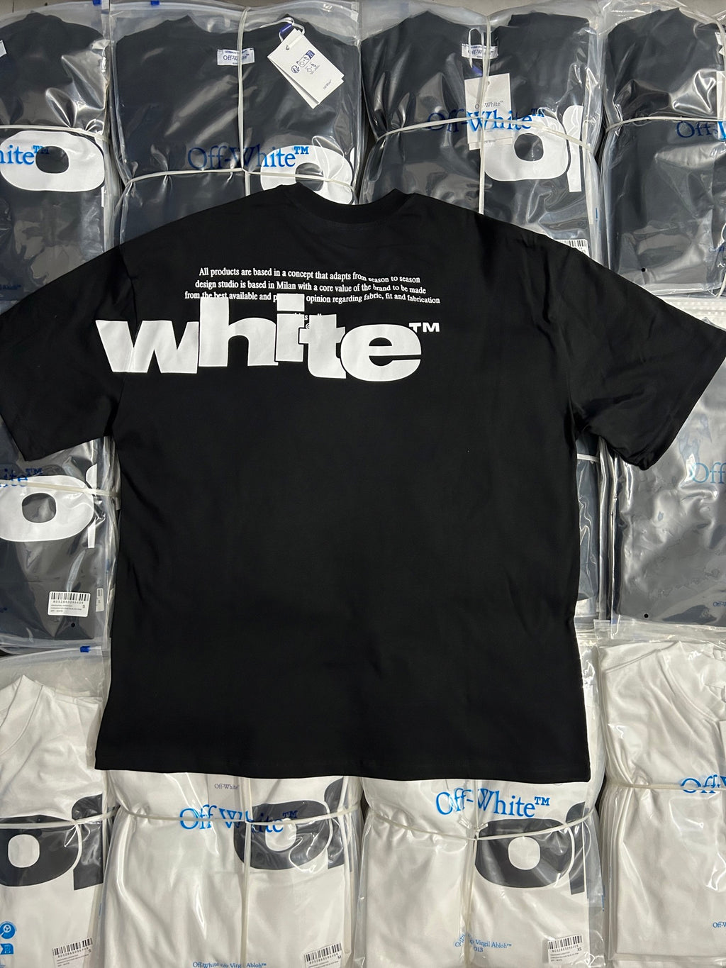 Black Off-White T-shirt with white 'whte' word logo graphic on the front