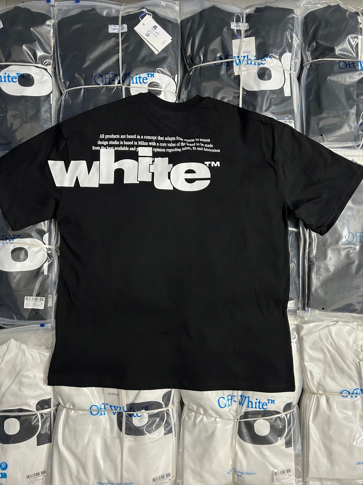 Black Off-White T-shirt with white 'whte' word logo graphic on the front