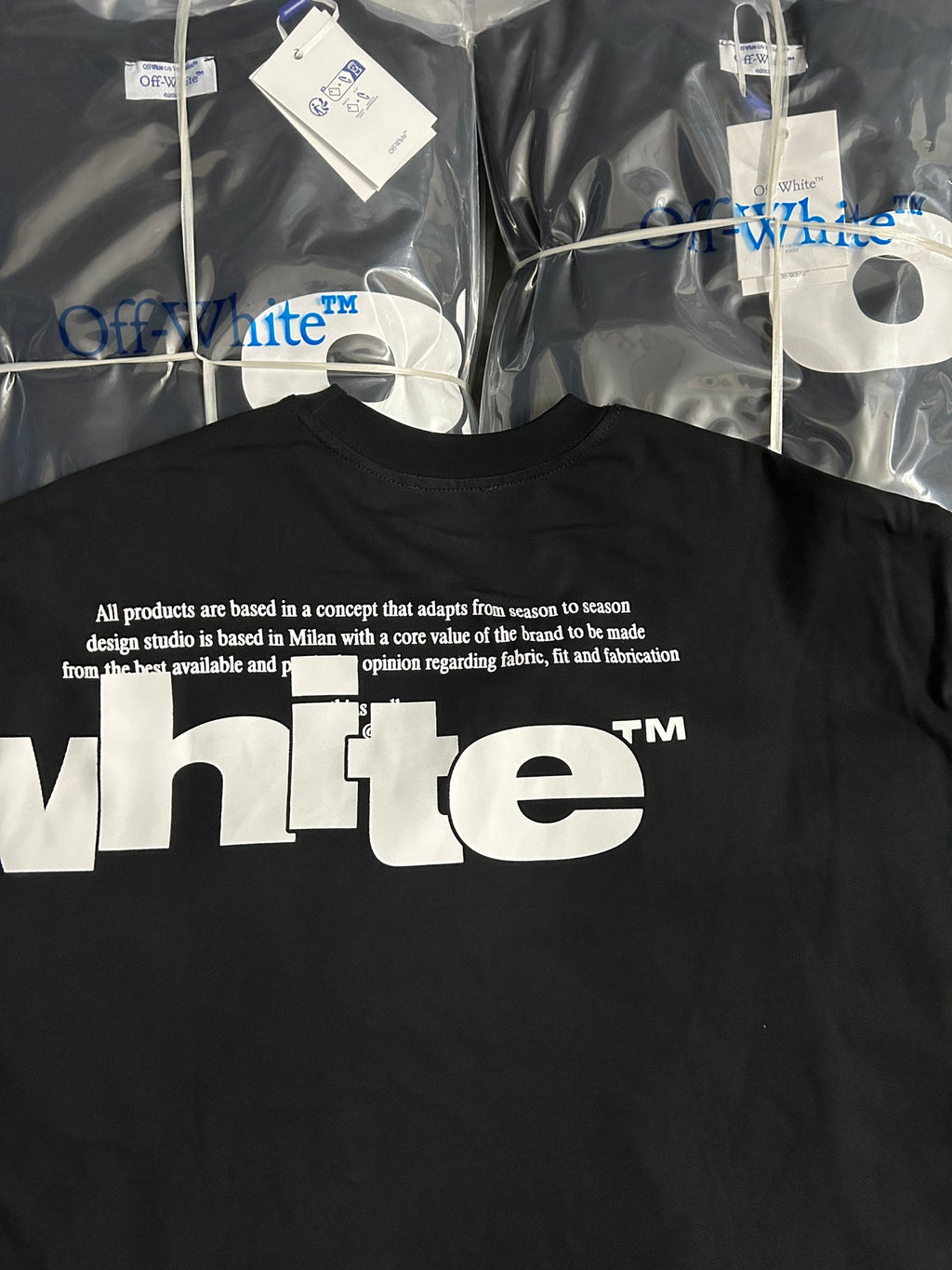 Black Off-White T-shirt back with small text and large white 'whte' graphic