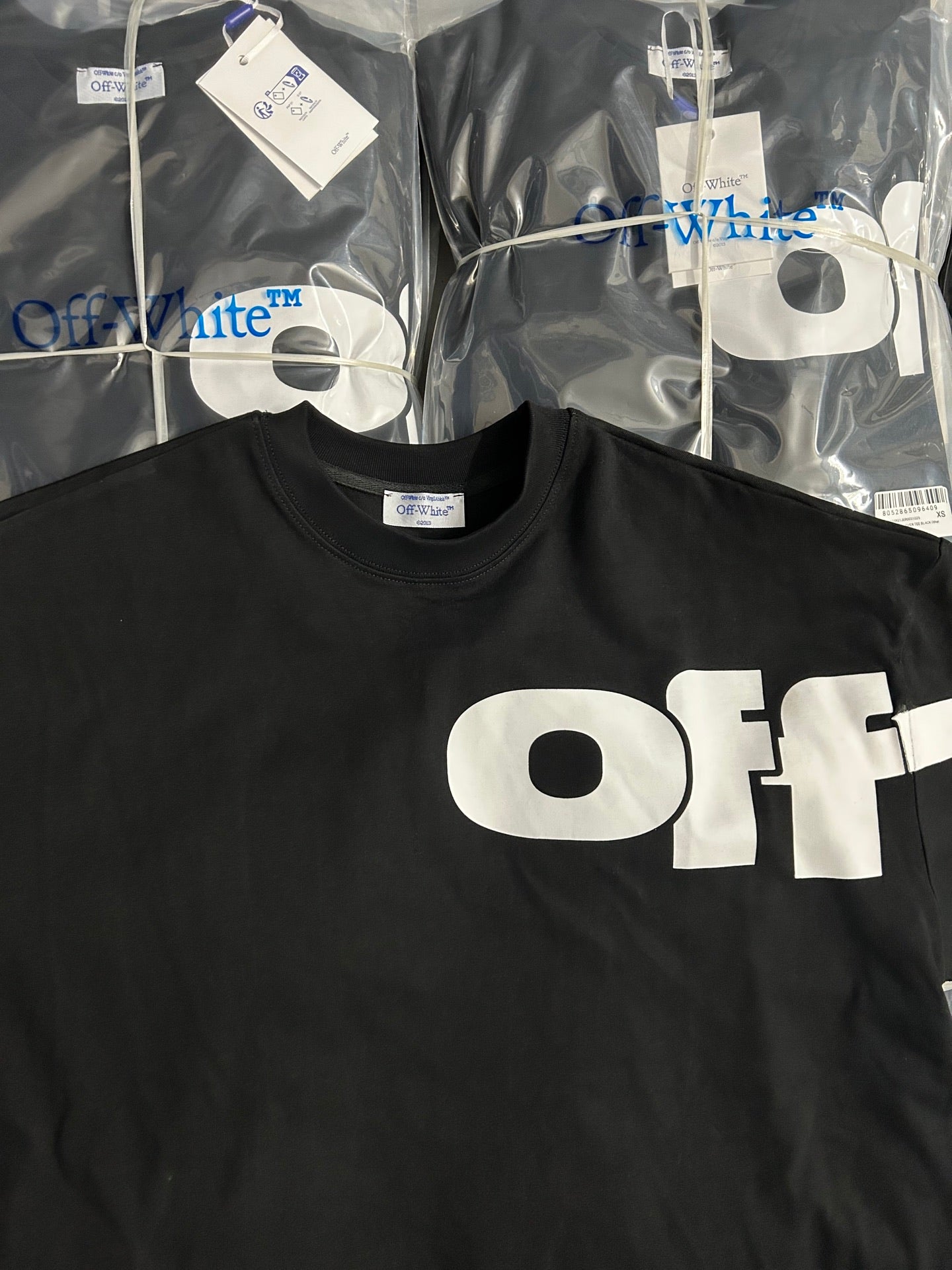 Black Off-White logo T-shirt with large white 'OFF' print across the chest