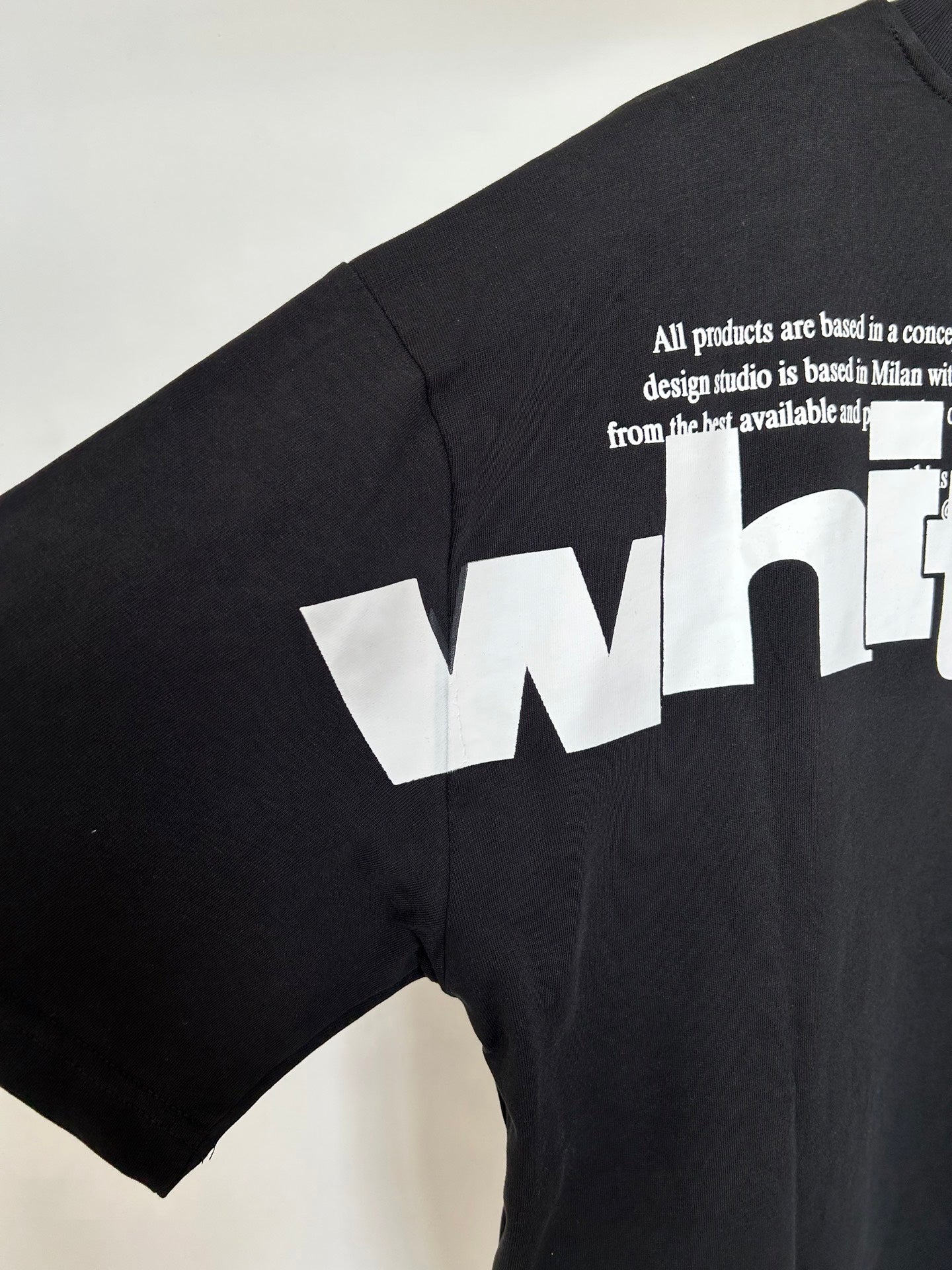 Off White T-shirt back side with quote text and large white 'white' graphic